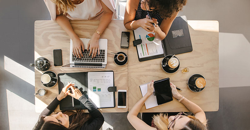 women working at desk photo